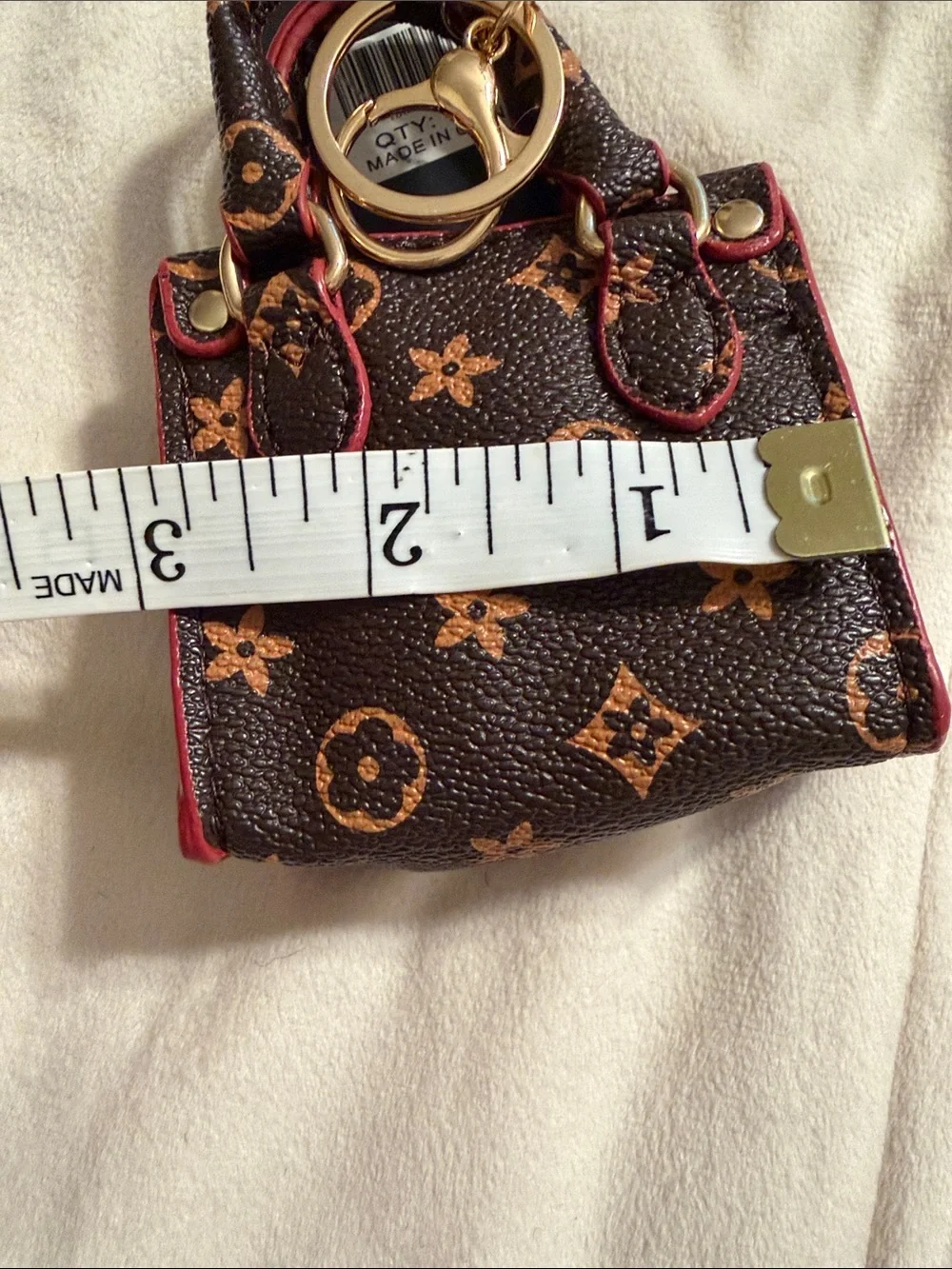Mini Brown Monogram Keychain Bag with Pink Trim. (85)